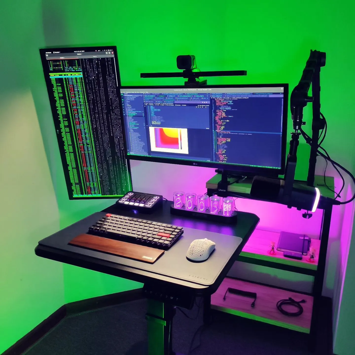 Neon-lit desk setup with monitor and keyboard